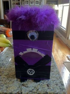 a purple and black box sitting on top of a counter