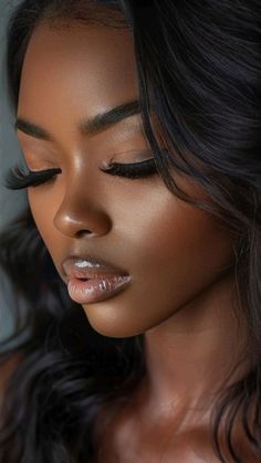 a woman with long black hair and silver lipstick on her lips is posing for the camera