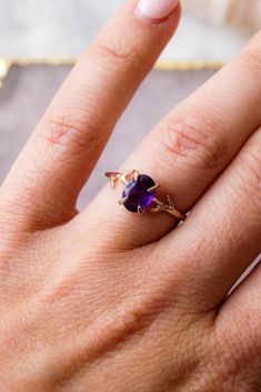 Our dainty Amethyst Ring is part of our new Birthstone Ring Collection! This beautiful, yet delicate ring is made with top-quality, genuine Amethyst. The February Birthstone represents beauty + courage. Not to mention, the unique look of the whimsical vine ring setting will ensure endless compliments. #amethystring #daintyrings #jewelry #rings #amethyst #februarybirthstone #birthstonejewelry #birthstones #wanderandlustjewelry Oval Rings With Gemstone Accents For Jewelry Making, Oval Amethyst Promise Ring With Accent Stones, Oval Amethyst Ring With Prong Setting For Promise, Oval Amethyst Promise Ring With Prong Setting, Marquise Amethyst Ring Gemstone Gift, Gift Marquise Amethyst Ring, Dainty Oval Purple Jewelry, Dainty Oval Amethyst Promise Ring, Purple Oval Amethyst Promise Ring