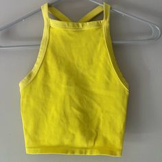 Never Worn Yellow Sporty Crop Top For Summer, Sporty Yellow Crop Top For Summer, Spring Casual Racerback Crop Top, Casual Racerback Crop Top For Spring, Yellow Stretch Cropped Tank Top, Yellow Workout Tops For Summer, Summer Workout Yellow Tops, Yellow Cropped Tank Top For Spring, Cropped Yellow Tank Top For Spring