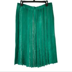 Description: Bottom's Style: Midi Skirt Material: Lamb Leather Color: Green Pleated Side Pockets Zip And Snap Closure At Side Condition: This Is An Used Item In Excellent Condition. No Visible Signs Of Wear. Measurements: Waist 32" Length 27.5" Green Lined Skirt For Formal Occasions, Formal Green Lined Skirt, Green Flowy Formal Skirt, Green Formal Midi Skirt, Summer Formal Silk Pleated Skirt, Formal Summer Silk Pleated Skirt, Formal Green Flowy Skirt, Spring Silk Skirt With Accordion Pleats, Elegant Green Lined Pleated Skirt