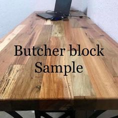 a wooden table with the words butcher block sample on it and an image of a laptop