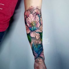 a person with a flower tattoo on their arm