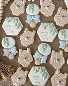 decorated cookies with baby's names on them are arranged in the shape of bears