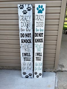 two wooden signs that say crazy dogs and do not knock them