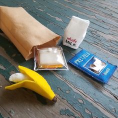 a banana, marshmallows, and other items are sitting on a table