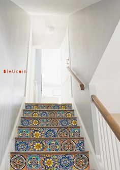 the stairs are decorated with colorful tiles