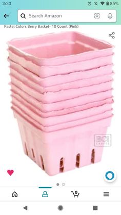 a stack of pink plastic baskets sitting on top of each other