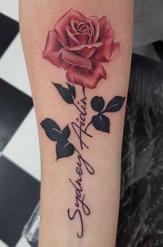 a rose tattoo with the words, i love you in cursive writing on it