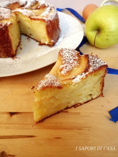 a piece of cake on a plate next to an apple