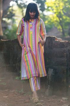 Multicolor straight kurta featuring Portuguese folk stripe print all over. Paired with a coordinating pant and an embroidered red jacket with side tie-up. - Aza Fashions Traditional Multicolor Designer Kurta, Designer Multicolor Salwar Kameez For Summer, Fitted Multicolor Block Print Kurta, Multicolor Kurta With Unstitched Blouse For Festivals, Multicolor Straight Kurta With Traditional Patterns, Multicolor Cotton Palazzo Set With Straight Kurta, Multicolor Cotton Pant Set With Printed Motifs, Unstitched Multicolor Handloom Salwar Kameez, Multicolor Unstitched Handloom Salwar Kameez