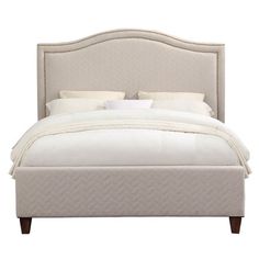 a bed with white linens and pillows on top of the headboard, in front of a white background