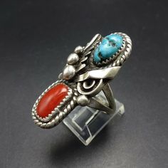 "VINTAGE NAVAJO TURQUOISE and CORAL RING by DAVID K LISTER DESCRIPTION: This ring will be a treasured addition to your collection of fine vintage Native American jewelry. MEASUREMENTS: Ring face measures 1 1/2\" x 5/8\" WEIGHT: 11.7 grams SIGNED: DKL, for David K Lister (Navajo) STERLING: unmarked, verified sterling silver" Vintage Turquoise Multi-stone Rings, Southwestern Gemstone Rings For Collectors, Southwestern Turquoise Ring, Jewelry Measurements, Vintage Native American Jewelry, Turquoise And Coral, Coral Ring, Navajo Turquoise, Vintage Navajo