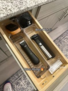 the drawer is open to show different types of grooming products in it and labeled