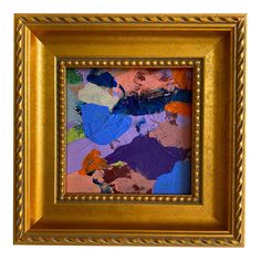 an abstract painting in gold frame with blue, purple and orange colors on it's surface