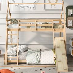 a wooden bunk bed with a slide on the bottom and mattresses underneath it in a child's bedroom