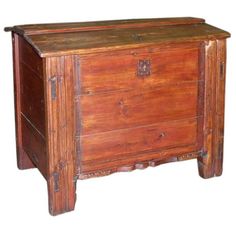 an old wooden chest with two drawers on one side and a drawer on the other