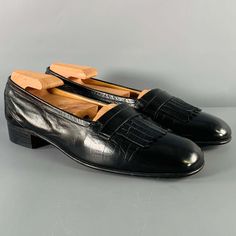 Hermes Loafers Comes In A Black Leather Featuring Eyelash Tassel Front And A Wooden Heel. Includes Dust Bag. Made In Italy.Very Good Pre-Owned Condition. Minor Signs Of Wear. Marked: 58104 17 7 1/2 Doutsole:10.75 Inches X 3.75 Inches Sui Generis Reference: 130048 Category: Loafers More Details Brand: Hermes Size: 7.5 Gender: Male Color: Black Pattern: Solid Fabric: Leather Style: Eyelash Condition: Vintage Age Group: Adult Sui Generis Designer Consignment Is An Award Winning Fashion Resale Store Formal Pointed Toe Tassel Loafers With Rubber Sole, Black Pointed Toe Formal Moccasins, Black Formal Moccasins With Pointed Toe, Timeless Round Toe Tassel Loafers For Formal Occasions, Formal Black Pointed Toe Moccasins, Timeless Tassel Loafers With Round Toe For Formal Wear, Timeless Black Tassel Loafers With Almond Toe, Formal Tassel Loafers With Leather Sole And Round Toe, Formal Tassel Loafers With Leather Sole And Flat Heel