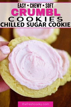 a hand holding a cookie with pink frosting on it and the words easy chewy soft crumbl cookies chilled sugar cookie