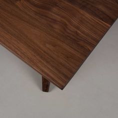 a close up view of a wooden table with no one on it or in the background