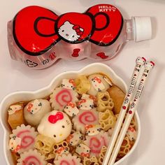 hello kitty candy and chopsticks in a bowl