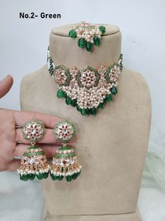 *Light Weight kundan choker set with earrings. *Necklace width- 2.6  inches(included drops) *Earrings Length- 2.7 inches *Earrings dome width- 1.2 inches Green Kundan Necklace With Tilla For Party, Green Kundan Necklace For Party, Green Kundan Choker Necklace With Cutdana, Green Kundan Choker Necklace For Diwali, Festive Green Kundan Choker, Green Cutdana Choker Jewelry, Green Kundan Choker In Temple Jewelry Style, Festive Green Kundan Choker Necklace, Green Kundan Bollywood Choker