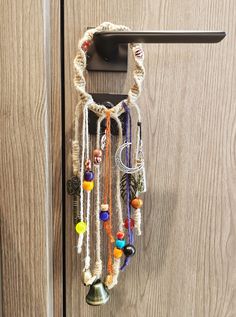 a door handle with beads hanging from it