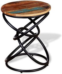 a small wooden table with metal legs and a circular design on the top, against a white background