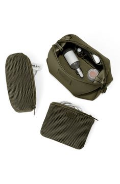 Fashioned from durable Repreve® recycled polyester, this toiletry bag is made to weather travel and everyday wear. Interior elastic loops and mesh pockets offer on-the-go organization for small essentials. Polyester Imported Asian Owned and Founded Functional Pouch With Luggage Sleeve For Everyday Use, Functional Everyday Pouch With Luggage Sleeve, Functional Everyday Use Pouch With Luggage Sleeve, Functional Travel Pouch With Luggage Sleeve, Functional Reusable Pouch Bag, Functional On-the-go Pouch With Luggage Sleeve, Versatile Nylon Travel Pouch, Functional Everyday Packable Travel Accessories, Functional Packable Travel Accessories