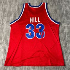 a red basketball jersey with the number 33 on it