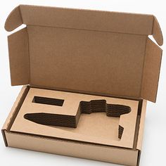 an open cardboard box with two knives in it