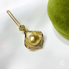 Highlight: Beautiful Golden South Sea Pearl Product Information OriginGolden South Sea Pearl Processed Jewelry in China MaterialSouth Sea Pearl, 18k Gold and Natural Diamond DimensionsPendant Approx. 2.1 x 4.0 cm Pearl Shaped: Round Size: 12-13 mm Quality: AAAA Nacre: Very Thick Color: Golden Luster: Very High Accessories Metal: 3.2g of 18k Gold Other: 0.134ct of SI Quality Natural Diamond Excluding Chain Golden South Sea Pearls, Classic Earrings, Sea Pearl, South Seas, South Sea Pearls, Sea Pearls, Pearl Pendant, Natural Diamonds, 18k Gold