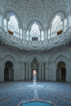 the inside of an ornate building with columns and arches