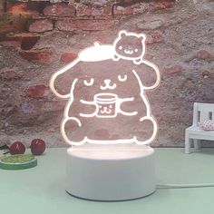 a lamp with a teddy bear on it