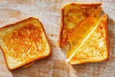 two pieces of toast sitting on top of a wooden table