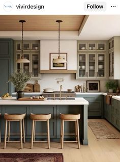 an image of a kitchen setting with green cabinets and stools on the counter top