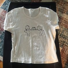 Brandy Melville John Galt Cream Colored Little Devils Baby Tee Never Worn Brandy Melville Baby Tee, Brandy Melville Clothes, Tinky Winky, Tops Brandy Melville, John Galt, Brandy Melville Tops, Baby Tee, Infant Tees, Brandy Melville