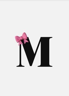 the letter m with a pink bow on it