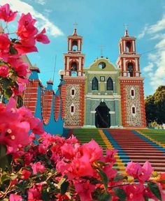 an image of a church with flowers in front of it and the caption that reads mexico, tiacaula, tiacala, mexico