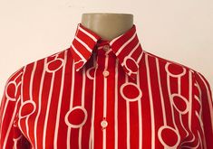 "True vintage top, featuring all over bold red and white geometric pattern, topped with a stately winged collar and classic button up placket. Designer label removed. Approximate Measurements: Shoulder: 14\"; Chest: 35\"; Length: 24.5\"; Labeled a Size 8 Fabric: 100% polyester Eye catching retro blouse, circa 1960s, is in excellent vintage condition. Enjoy! *(International Buyers are welcome - however, please email me so I can check the shipping rate for you before committing to buy.) bt" Retro Fitted Shirt For Office, Vintage Red Top For Formal Occasions, Red Retro Print Shirt For Spring, Retro Red Formal Tops, Retro Fitted Office Shirt, Classic Fitted Red Blouse, Red Retro Formal Tops, Retro Fitted Top With Collared Neckline, Classic Red Tops With Collared Neckline