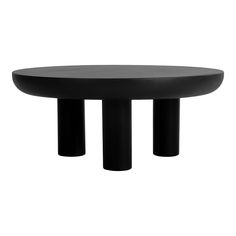 a black table sitting on top of a white floor