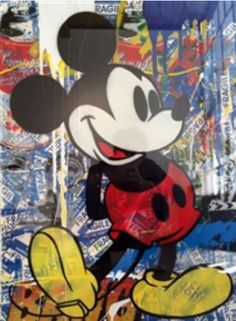 a mickey mouse painting is shown on the side of a piece of paper with stickers all over it