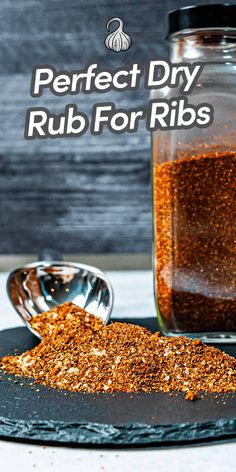 a glass jar filled with rubs on top of a plate next to a spoon