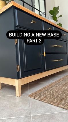 a blue cabinet sitting on top of a floor next to a rug