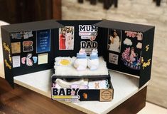 a baby's photo album is displayed on a table