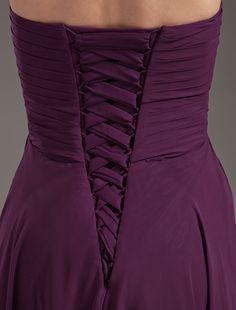 the back of a woman's purple dress