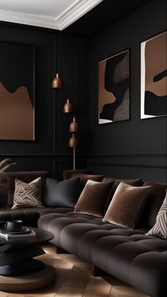 a living room with black walls and brown furniture