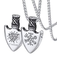 two pendants with the words custom on them and an image of a cross in the middle