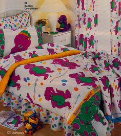 a child's bedroom with colorful bedding and toys