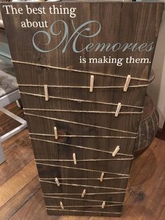 a sign that says the best thing about memories is making them with clothes pins attached to it